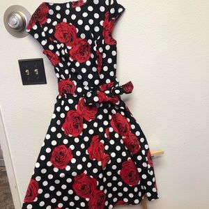 Vintage black dress with white polkadots and red flowers. Size small with belt.